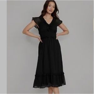 Waist defined, flutter sleeve, midi dress. Never worn, tags still on.